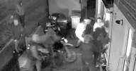Horrifying moment 12 thugs storm a property after battering down door with motorbike