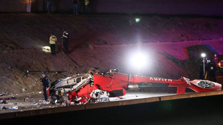 Motorists rish to lift helicopter that crashed on Sacramento highway