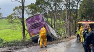 Emergency crews rescue 12 people after V/Line bus crashes down embankment in regional Victoria