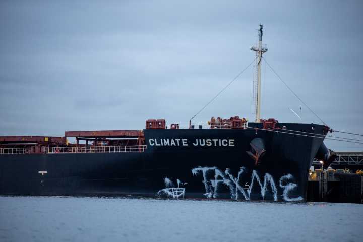 ‘Tax me'... Rising Tide paints coal ship in act of protest