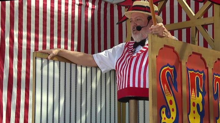 Midway Barker at State Fair of Texas has happily been stuck in one place