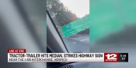 Tractor-trailer drives through median, strikes sign on I