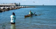 Paddlers racing to the bottom of Mobile Bay