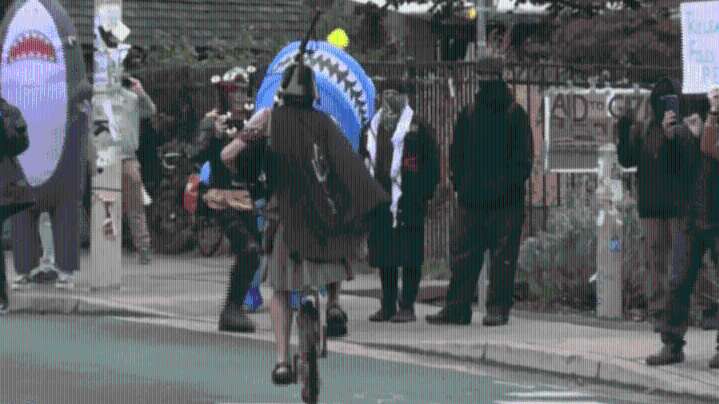 Unipiper rides with protesters at ICE facility