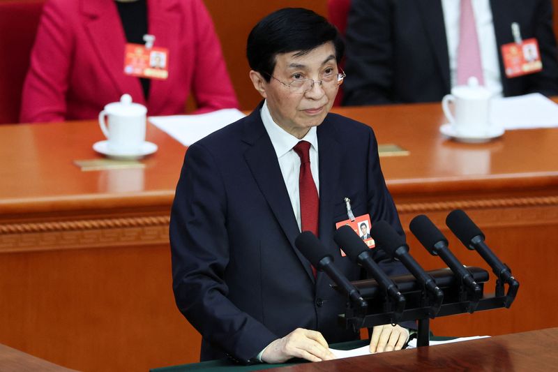 Top China official says peaceful 'reunification' with Taiwan is best path forward