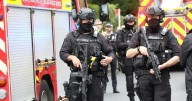 Manchester terror attack suspect pictured dead with blade and 'bomb' next to him