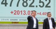 Asian markets mostly higher in quiet holiday trading after AI deals push Wall St to more records