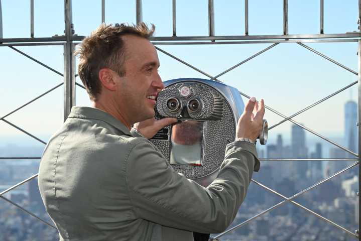 Tom Felton lights the Empire State Building in Slytherin green for Broadway debut