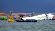 2 killed after cargo plane in Hong Kong veers off runway