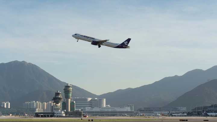 A cargo aircraft skids off a Hong Kong runway into the sea, killing 2 people