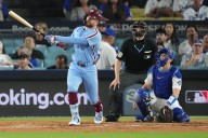 Kyle Schwarber hits two home runs to lift the Philadelphia Phillies over the Los Angeles Dodgers and avoid NLDS sweep