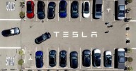 Parents of college student killed in Tesla crash say design flaw in door trapped her as car burned