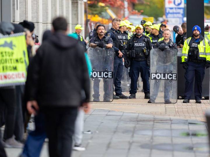 Man charged after assault during defence conference protest: Police