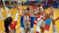 See photos as Churchill Lancers volleyball downs the Thurston Colts