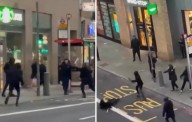 Shocking moment young boys with machetes brawl on busy high street in east London