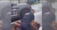 Altercation between parent and police officer over school parking caught on camera