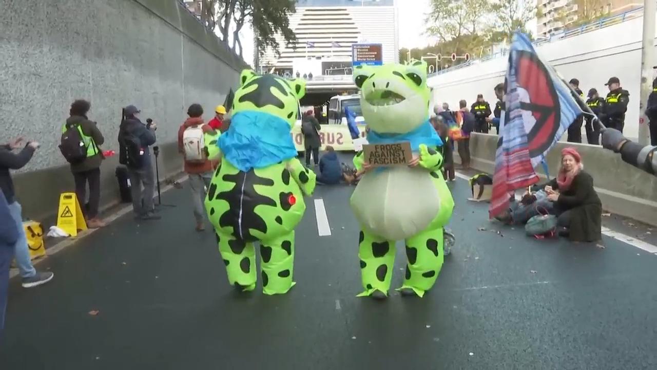 Dozens of climate protesters close down part of busy highway into The Hague on day before election