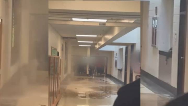 Brown water floods hallway at Quince Orchard High School