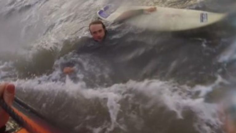 Video shows surfer being rescued by RNLI after powerful rip current dragged him out to sea
