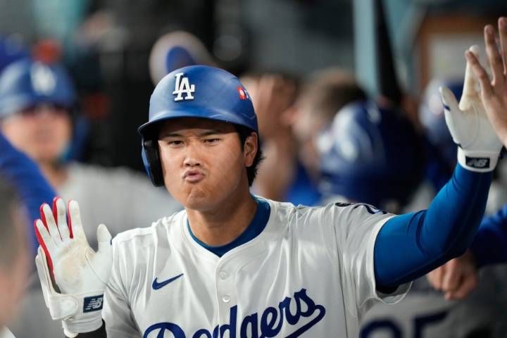 Ohtani hits 2 homers for Dodgers in playoff opener against Reds