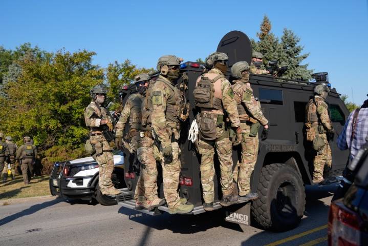 Noem visits Chicago area ICE facility as agents arrest 13, raid city neighborhoods