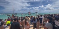 About a thousand gather to honor the life of well-known waterman Hopena Pokipala