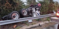 Driver suffers minor injuries after semi-truck loses control in rain, overturns in Madison County