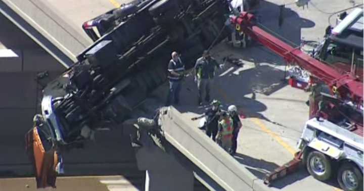 Tow truck dangles off McKinney overpass in dramatic crash