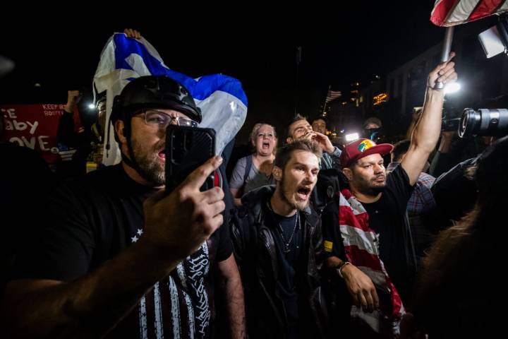 Photos of the mixed reactions to Trump's bid to deploy troops to more US cities