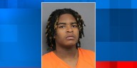 18-year-old charged after moving vehicle shot at