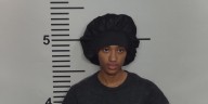 Woman arrested in connection to double homicide at Okolona apartment complex