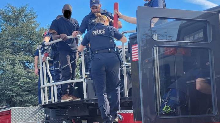 Burglary suspect climbs onto roof to escape capture
