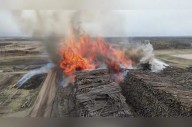 Pulp mill fire contained, estimated 100,000 cubic metres of logs lost, fire chief says