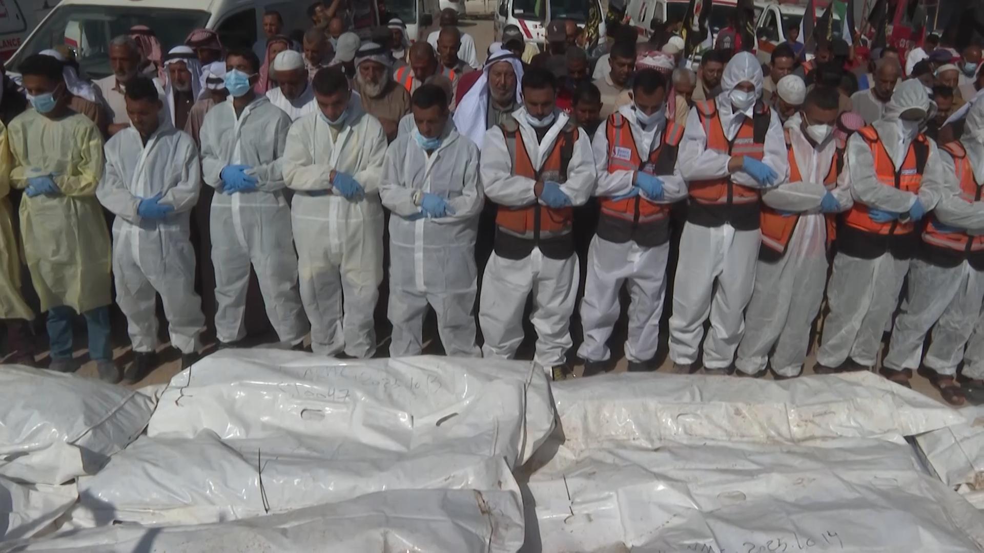 Prayers for the dead as bodies of 54 Palestinians buried in Gaza after return by Israel