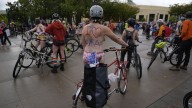 Naked bike riders demonstrate against federal troops in 'quintessentially Portland' protest
