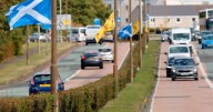 Anti-racists 'threatened with slit throats' after trying to remove Saltire flag from lamppost