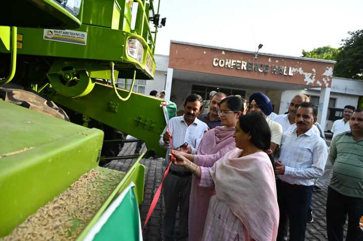 DDC Presents keys of Combine Harvester to HADP beneficiaries