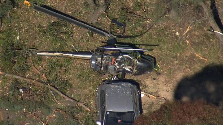 Man dead and teen fighting for life as helicopter crashes onto car near Bankstown in Sydney