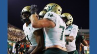 No. 24 South Florida scores 4 TDs in a 3 1/2-minute span and hands North Texas its 1st loss