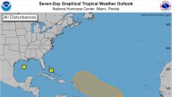 Chances system near Florida will form are now zilch. Tampa Bay still to get wind, some rain
