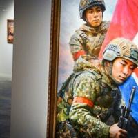 Kim, kimchi and machine guns: Russia exhibits North Korean art