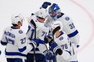 Lightning hold off Bruins to secure 1st win of season