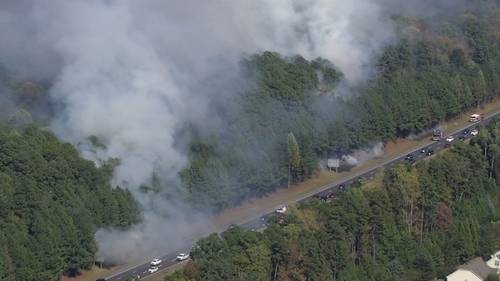 Lanes of I-540 reopen after multiple brush fires