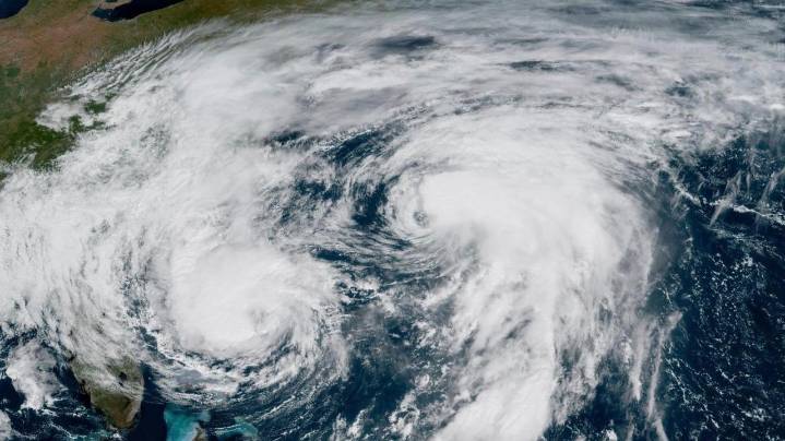 Bermuda lashed by distant hurricane and prepares for the stronger Imelda