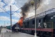 One dead and dozens injured as Russian drones hit Ukrainian railway station