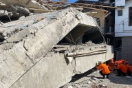 Crews race to save kids trapped in rubble of Indonesian school