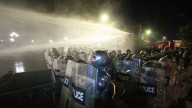Georgia's police use water cannons to push back protesters trying to storm presidential palace