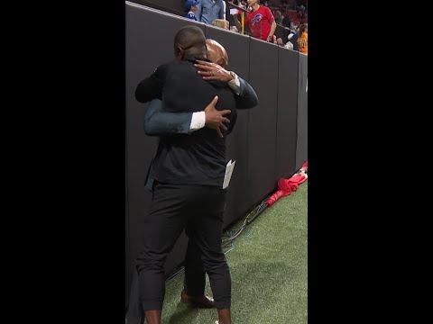 Falcons head coach Raheem Morris and GM Terry Fontenot celebrating Monday Night Football win