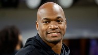 Former NFL star Adrian Peterson arrested in Houston suburb on DWI and gun charges