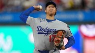 Ohtani's pitching leads Dodgers to Game 1 win despite 4 strikeouts at the plate